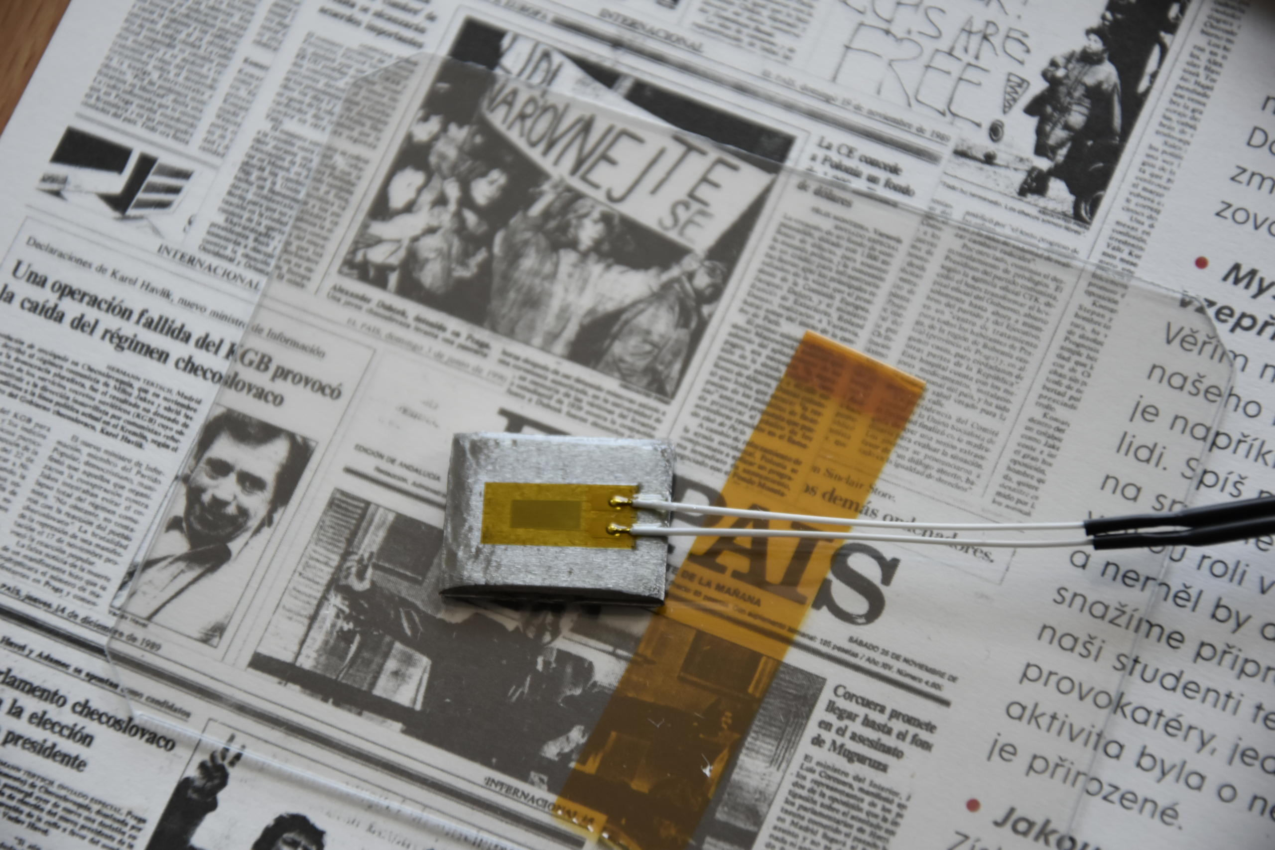 Detail of dummy strain gauge glued on a grinded, cleaned and degreased steel plate.