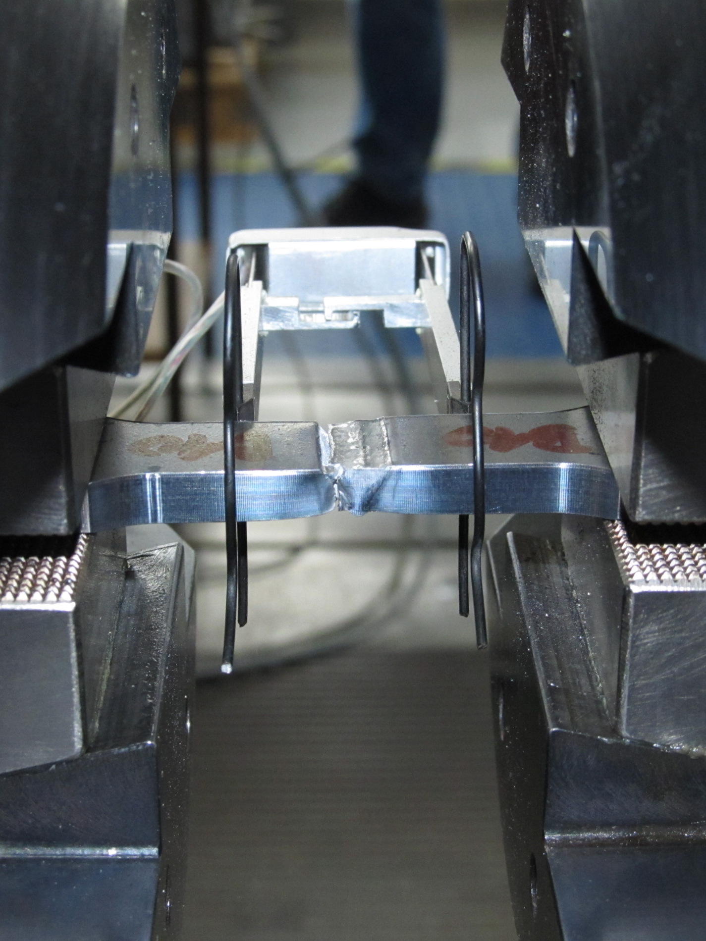 Tensile strength test of a welded steel specimen